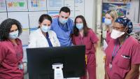Kristin M. Burkart, MD, MSc, holds a meeting